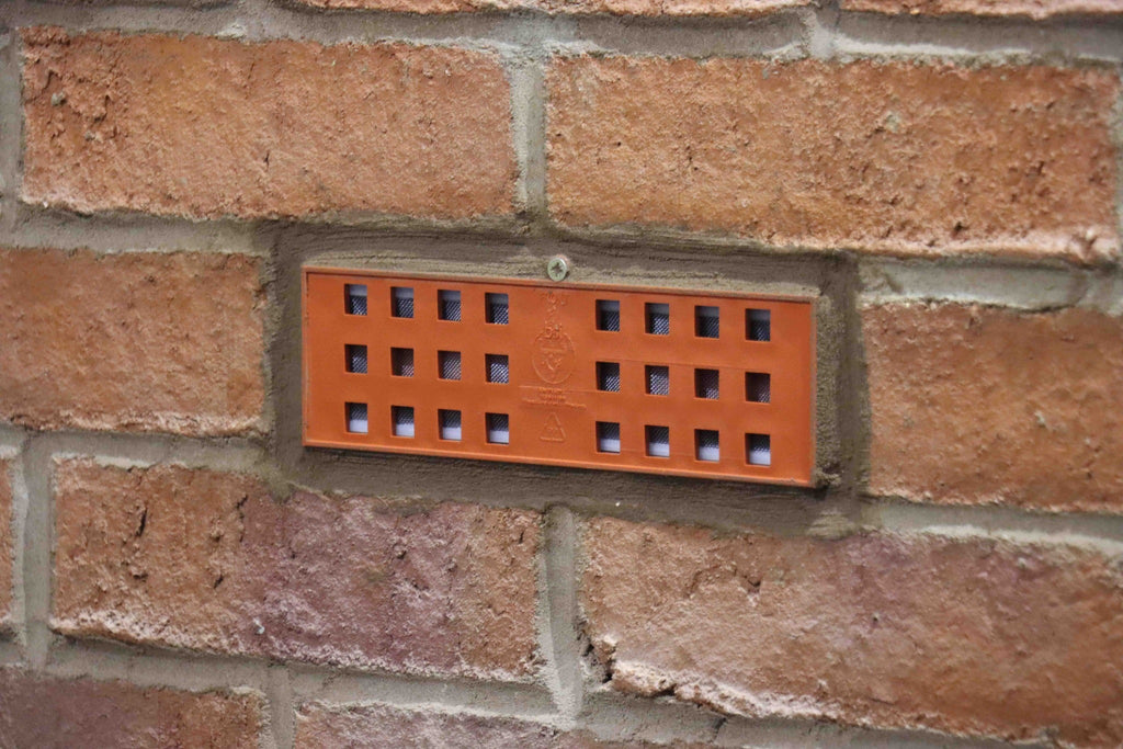 Fernco Anti-Flood Air Brick installed in a brick wall