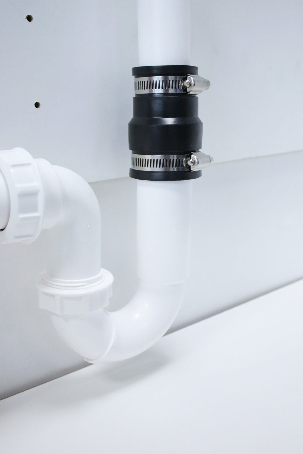 Fernco EPDM adaptor coupling on a u-bend detail