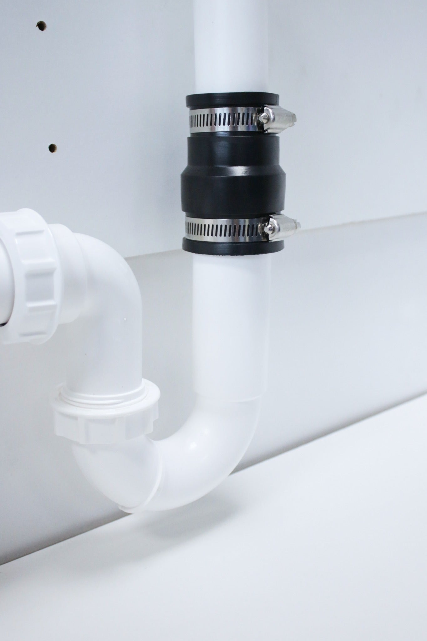 Fernco EPDM adaptor coupling on a u-bend detail